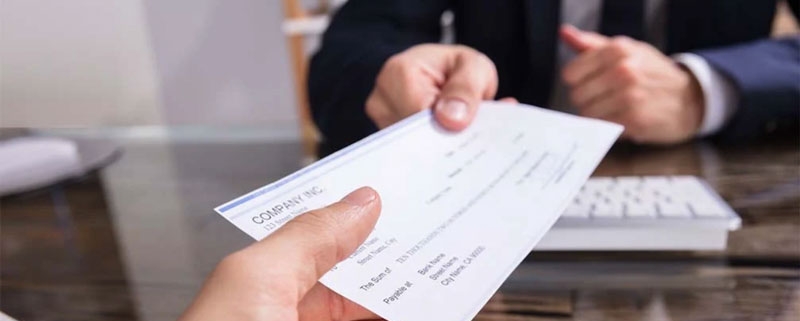 Handing over a check for check fraud inspection