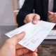 Handing over a check for check fraud inspection